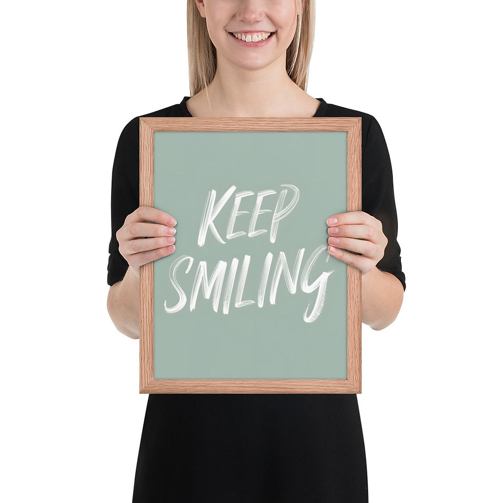 Thumbnail: Framed poster with "Keep Smiling" text in white on a sage green background, in a black matte frame, ideal for framed wall art decor.