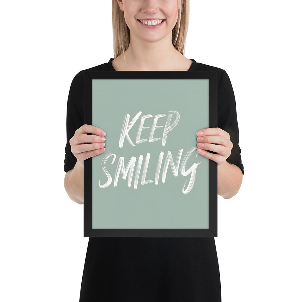 Thumbnail: Framed poster with "Keep Smiling" text in white on a sage green background, in a black matte frame, ideal for framed wall art decor.