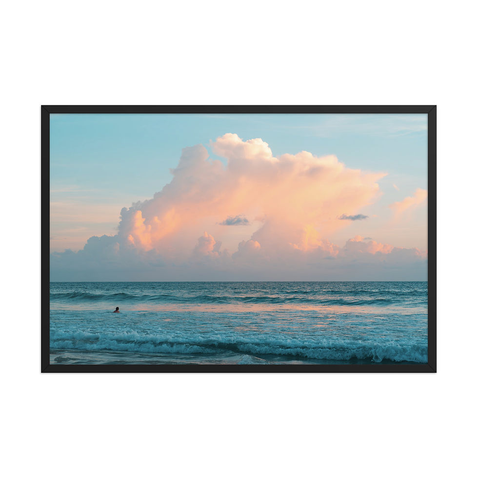 Thumbnail: Framed poster of a serene ocean scene with a lone swimmer, pink cloud, and turquoise sea, presented as framed wall art.