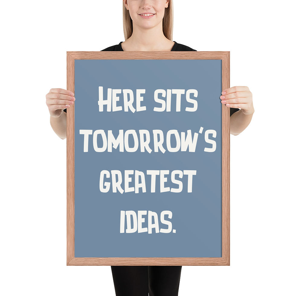 Thumbnail: Framed poster with white text on blue background, "HERE SITS TOMORROW'S GREATEST IDEAS," in black frame, ideal framed wall art for bathroom walls.