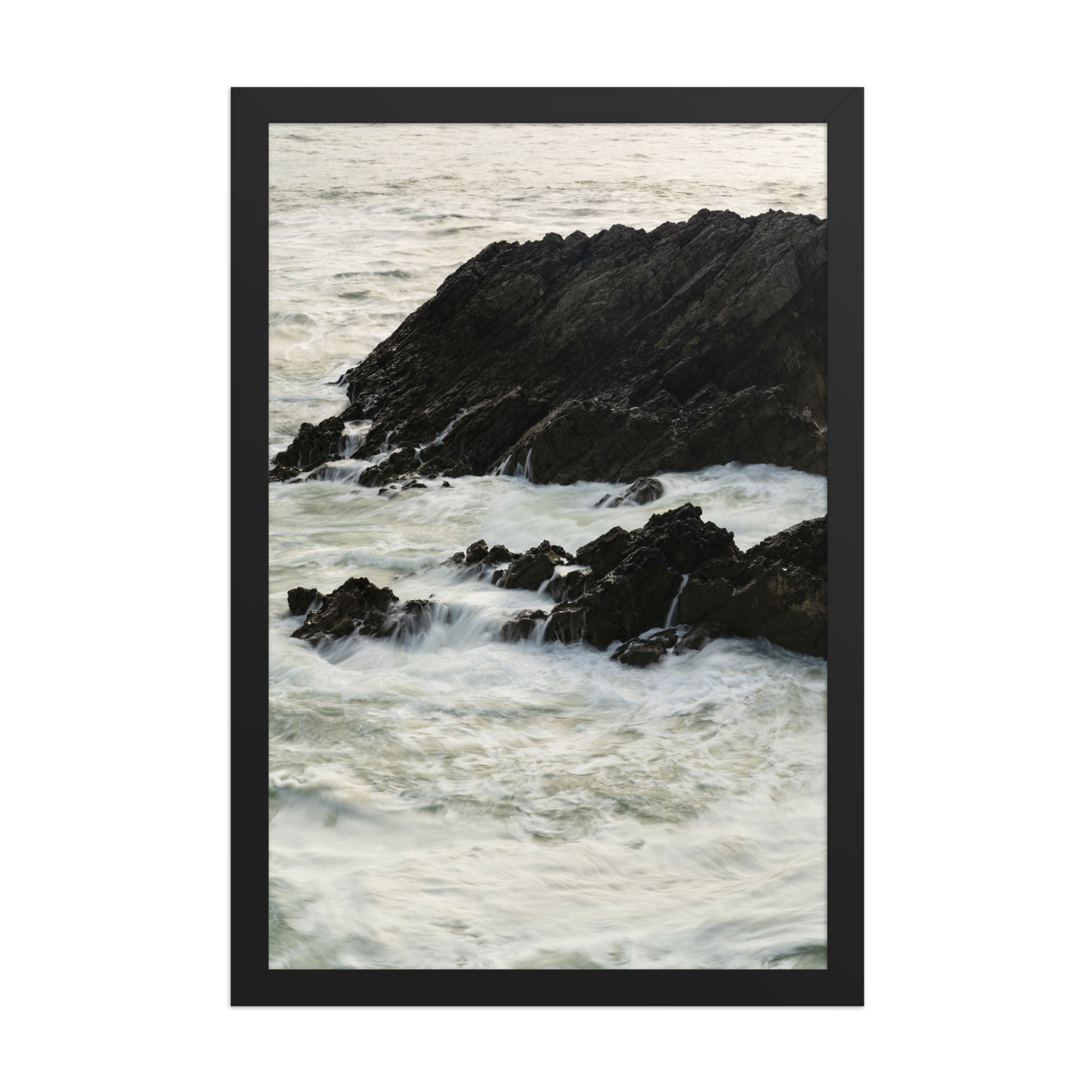 Framed wall art of ocean waves crashing against rugged rocks, framed poster in sleek black frame, dynamic coastal scene, Frameifi, Ocean's Embrace.
