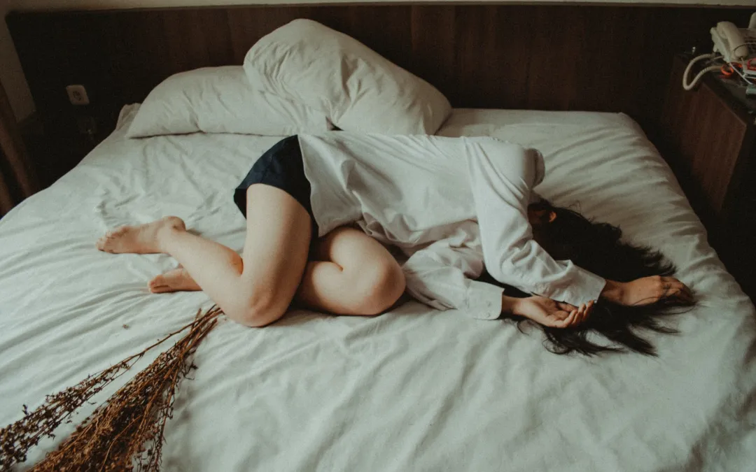 Woman sleeping on bed suffering from Treatment-Resistant Depression may need ketamine therapy