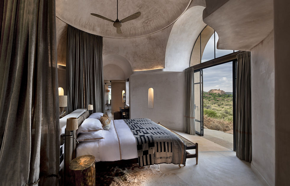 Aerial view of &Beyond Suyian Lodge nestled in Kenya’s Laikipia wilderness, surrounded by rocky outcrops and open savannah, with private plunge pools and panoramic views.
