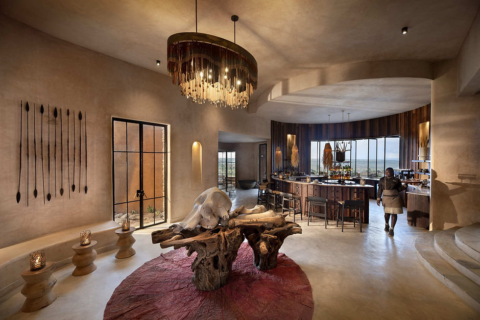 Aerial view of &Beyond Suyian Lodge nestled in Kenya’s Laikipia wilderness, surrounded by rocky outcrops and open savannah, with private plunge pools and panoramic views.