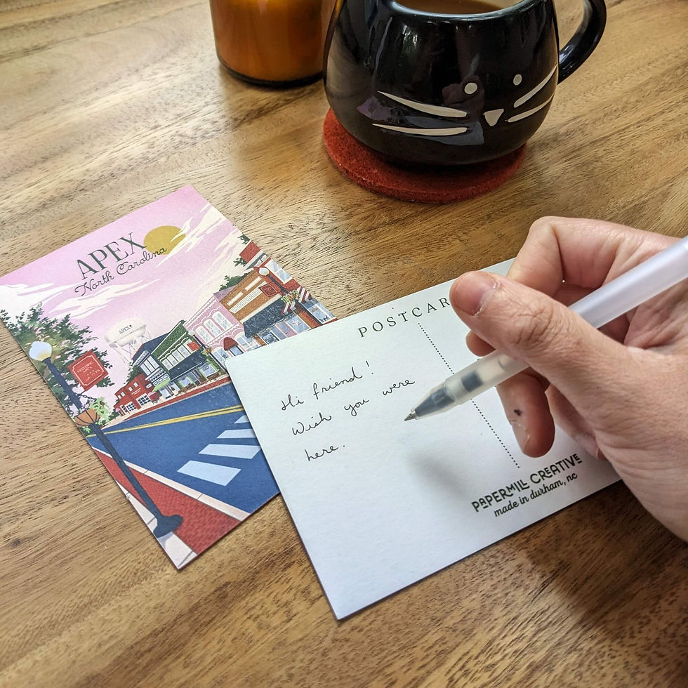 Thumbnail: A hand is shown writing a message on the Apex postcard