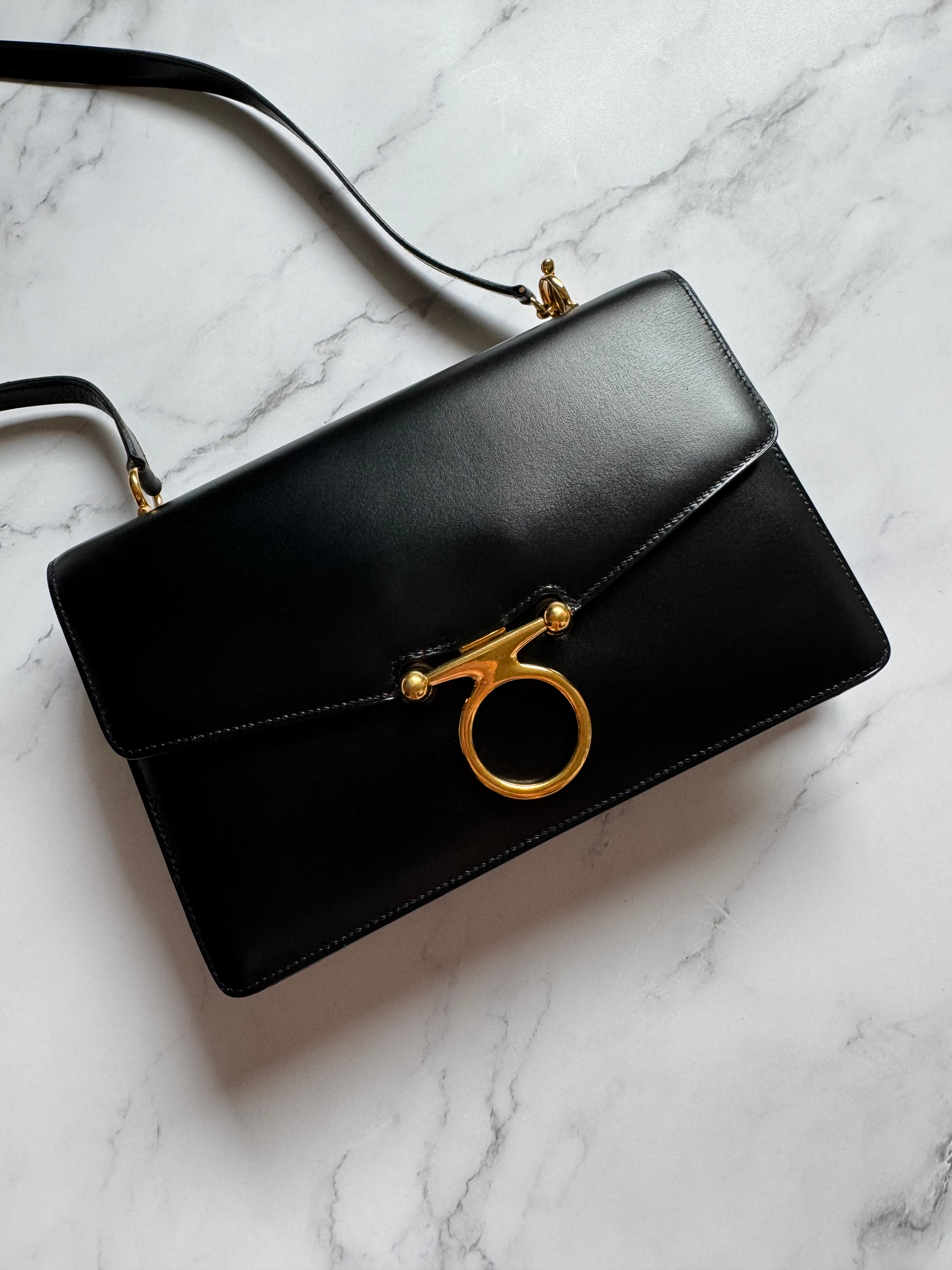 Hermes’ Vintage Black Box Flap in GHW