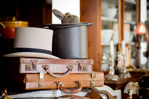 Antique briefcases and hats