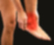 Person holding the lower leg and ankle with visible redness, indicating pain or inflammation in the distal tibia and ankle joint area.