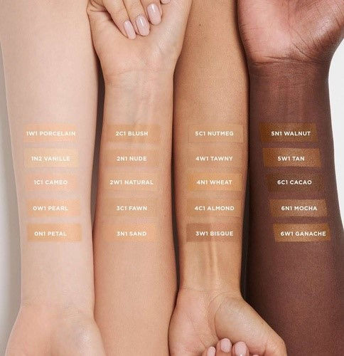 iknoweverything's article 10 best foundations for oily skin dermatologist recommended image showing different shades of product on 4 different shades of hands