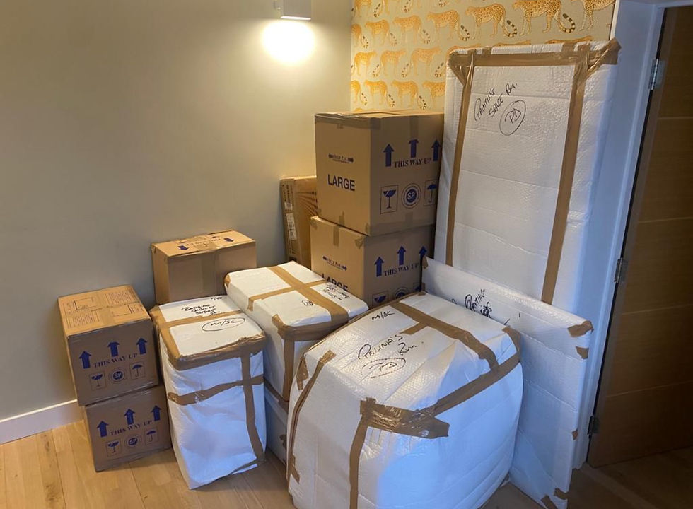Close-up view of glassware being wrapped for a household move