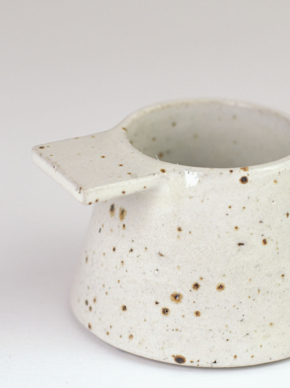Thumbnail: Handmade ceramic white fleck tea light candle holder with tab detail
