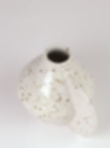 Handmade ceramic bud vase in a fleck stoneware with 3d detail