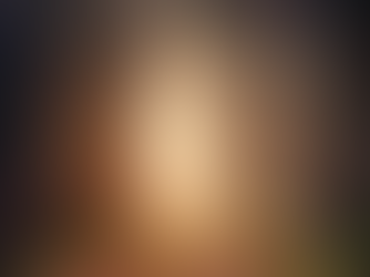 Sunlight filters through tall forest trees onto a leaf-covered path. Autumn leaves and mist create a serene, magical atmosphere.