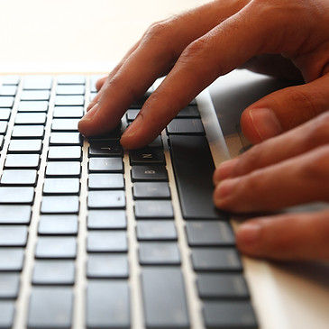 hands on a computer keyboard