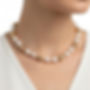 Pearls and golden color beads chocker necklace with adjustable closure.