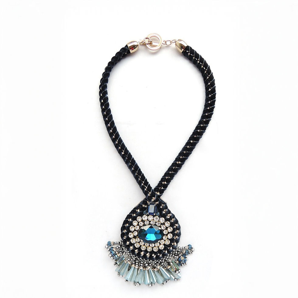Statement necklace featuring a large central blue crystal, handcrafted on blue velvet with cascading crystals, luxurious desi