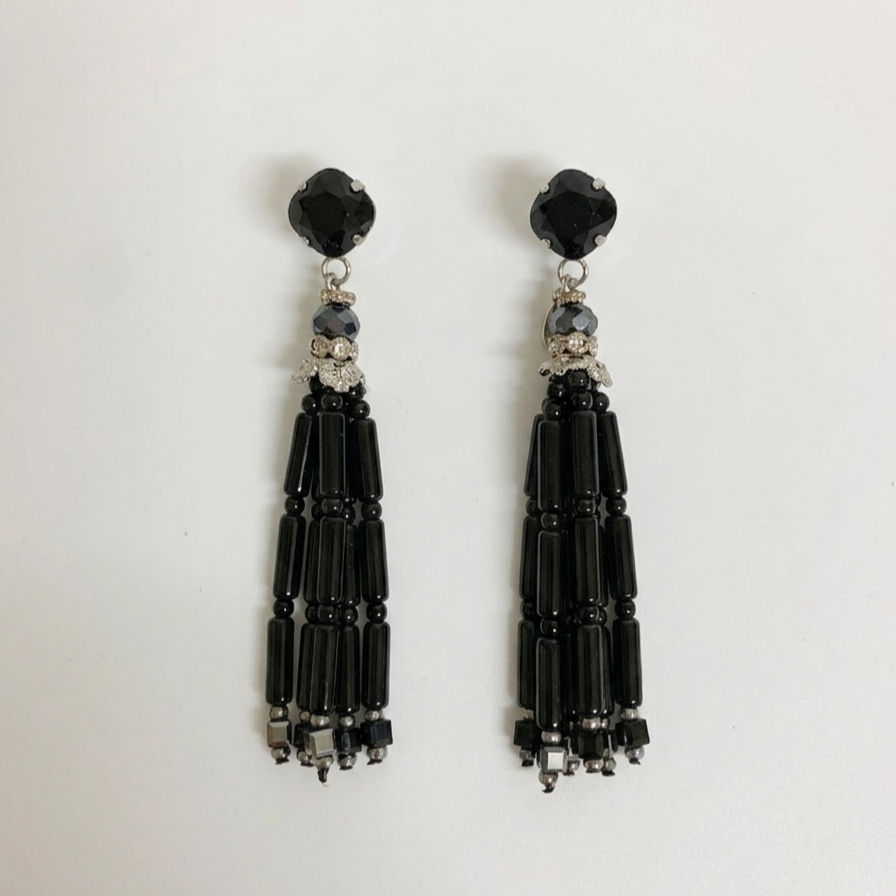 Black crystal tassel-style drop earrings with post and butterfly backings.