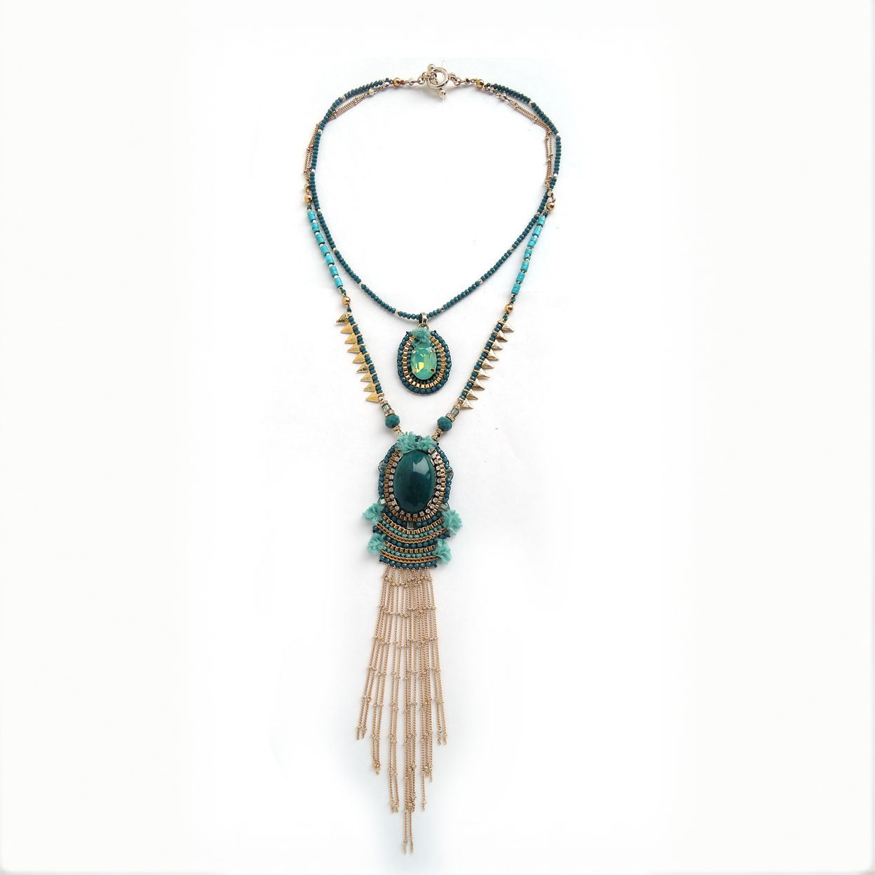 Medium petrol blue necklace with double strand and pendant embroidered with Swarovski crystals.
