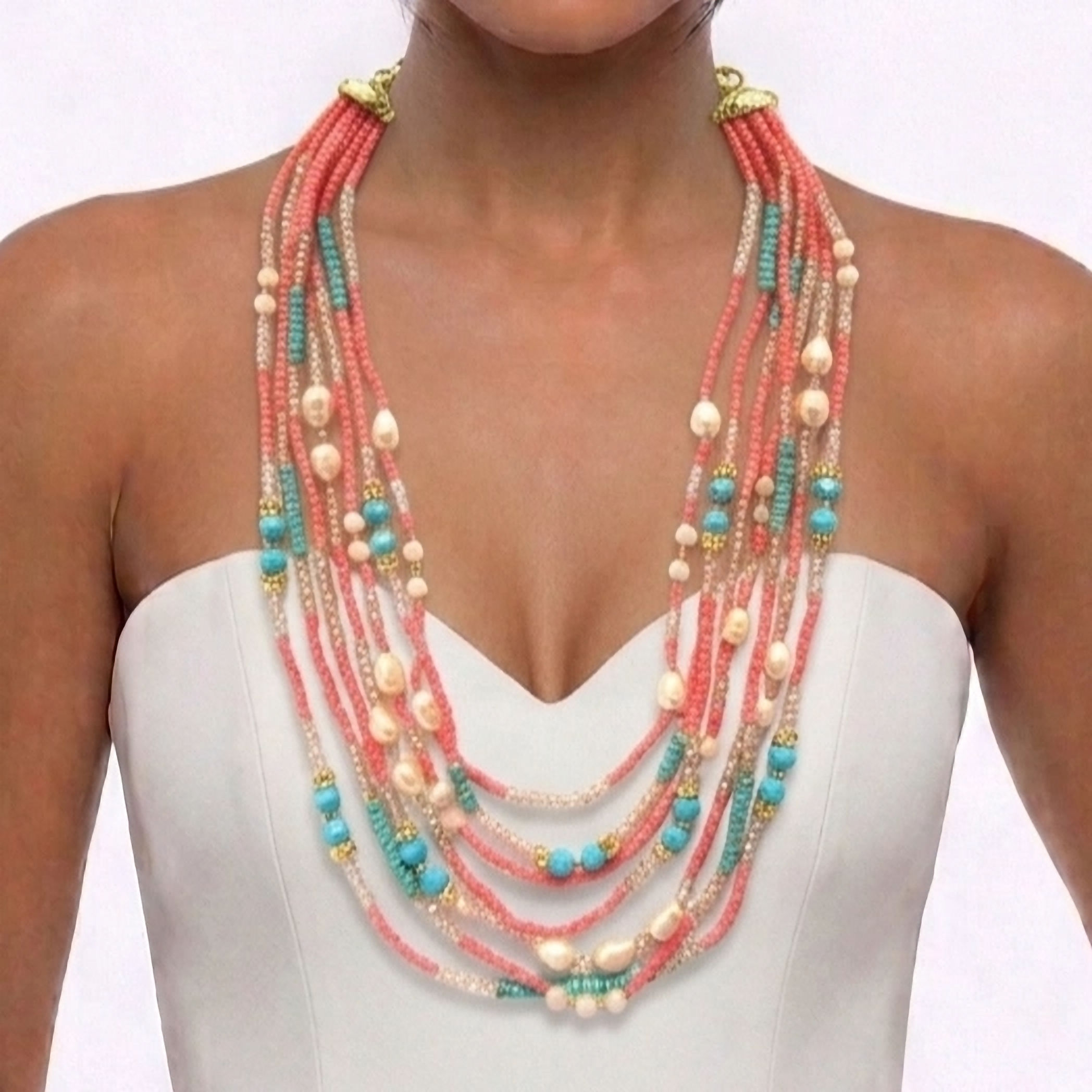 Long multi-strand pink coral necklace handcrafted with beautiful crystals, river pearls and Indian turquoise.