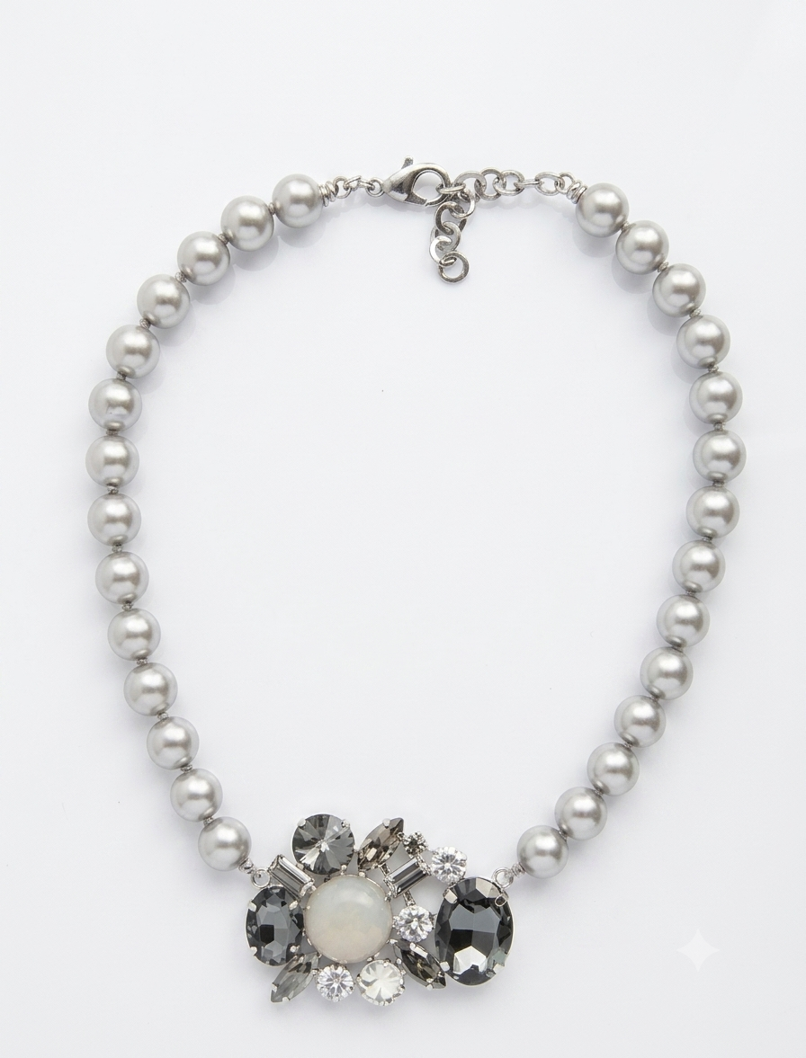 Choker necklace featuring grey shell pearls interspersed with small knots and a central Swarovski crystal pendant.