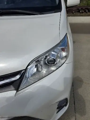 Restored automotive headlight after headlight restoration by Invictus Mobile Auto Glass
