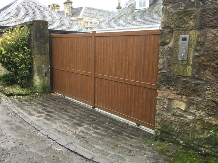 Aluminium gates with wood finish installation in Scotland  by CM Gates & Barriers