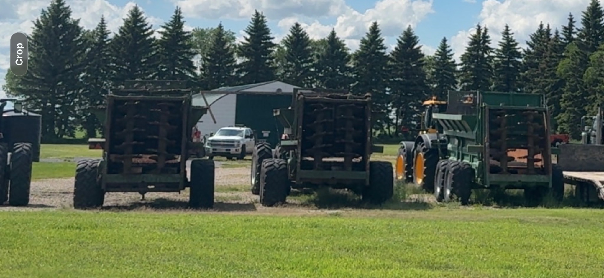 Tractors and Bunning manure spreaders at the yard