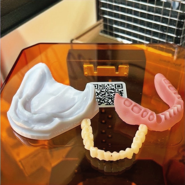 Dental molds and QR code display for dental office procedures and equipment.