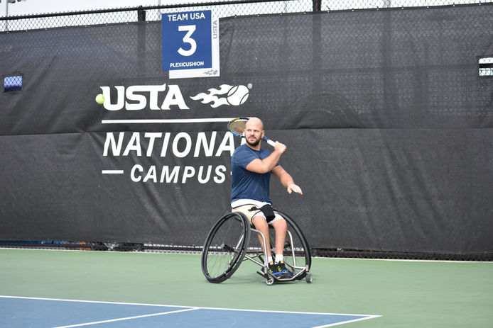 wheelchair tennis player stefan olsson swings on court