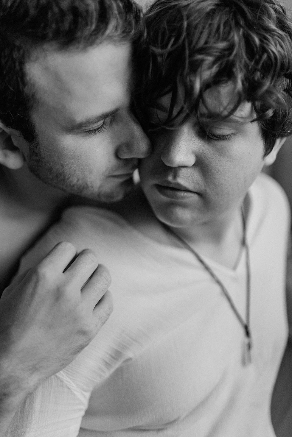 a homosexual couple hugging, boy loves boy