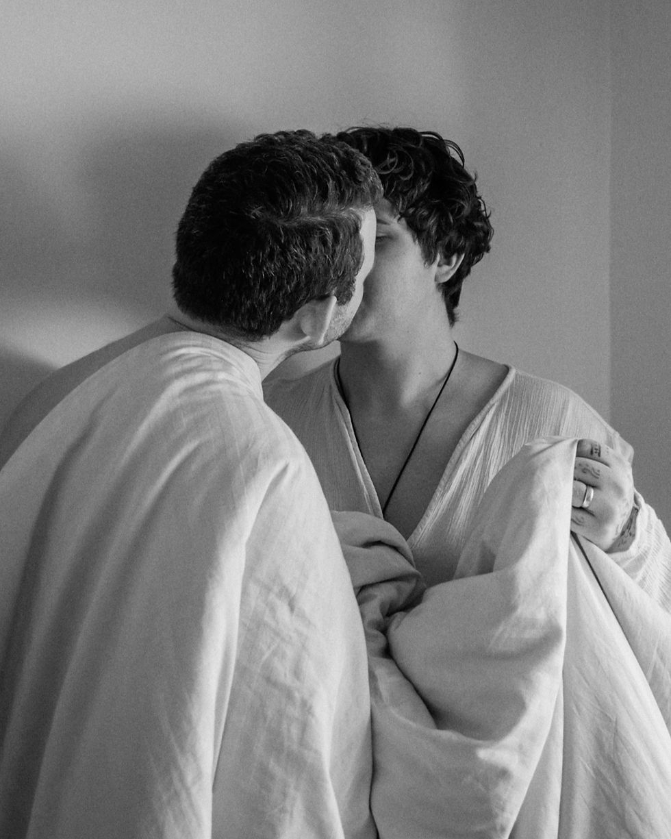 a hbtq couple, gay couple kissing, in-home photo session