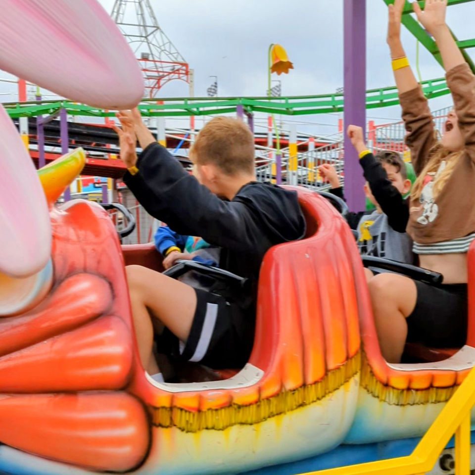 Children enjoying rides at Clacton Pier on the Essex coast