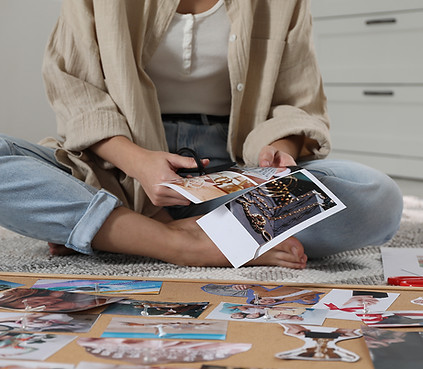 creating-vision-board-woman-cutting-out-pictures for her Poster DIY Vision Board