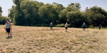 detectorists in a field