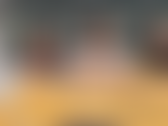 Two Gen Z women and a man posing together in a photo-booth frame.