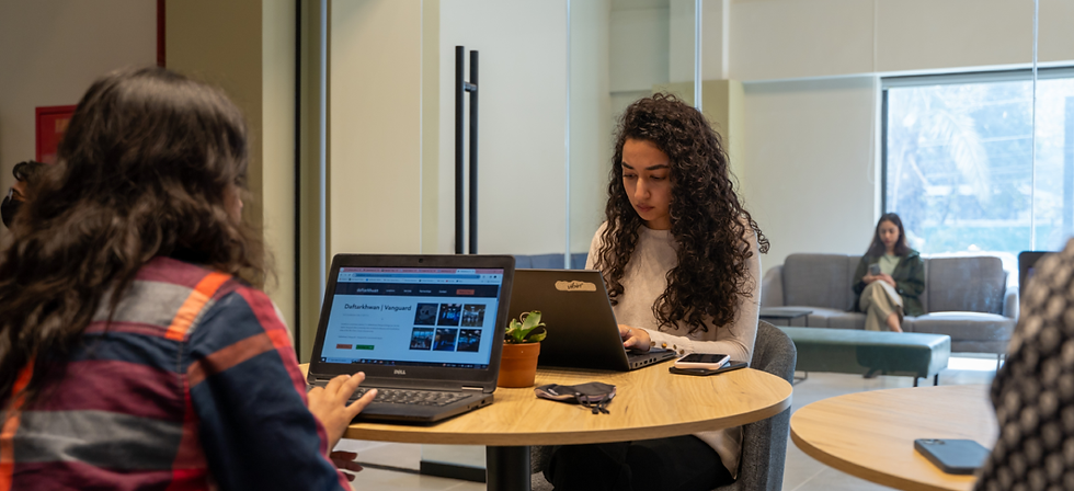 Women sitting in a lounge and concentrating on their work