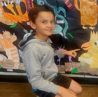 Child in front of artwork