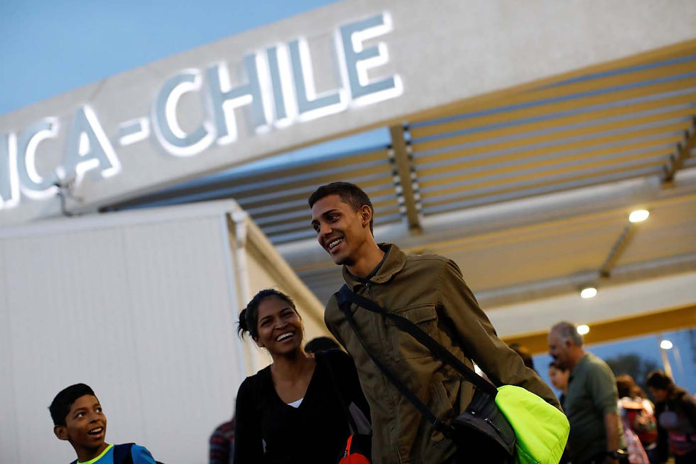 Natacha Rodriguez (C), traveling by bus from Caracas to Chile, talks with fellow travelers while they wait to board at the bus station in Tumbes, Peru, November 11, 2017. In Tumbes, the first stop after crossing from Ecuador to Peru, passengers had to transport their luggage by three-wheel moto taxis from the arrival point to another bus station, as each company has its own terminal. When they got there, they realized that the only way to buy the tickets to continue the journey was with Peruvian soles. So they talked and agreed that one group would go to an exchange house several blocks away, carrying everyone’s cash, while others waited and took care of the luggage. REUTERS/Carlos Garcia Rawlins SEARCH “RAWLINS BUS” FOR THIS STORY. SEARCH “WIDER IMAGE” FOR ALL STORIES.