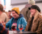 People in restaurant enjoying Next Question! Trivia