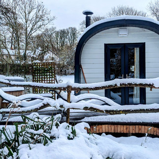 Glamping pod and hot tub in winter