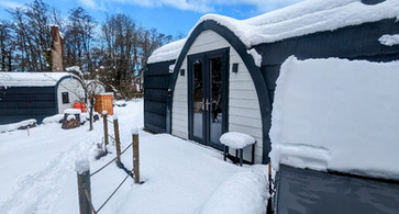 Snow lies on the Ayr glamping pod at Emlyn's Coppice, North Wales.