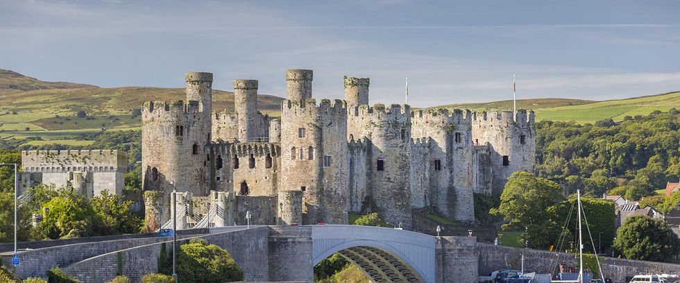 Eye-level view of the rugged Conwy Castle with surrounding landscape