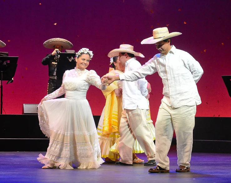 Renata (Cecilia Duarte) and Laurentino (Octavio Moreno) join Lupita (Vanessa Cerda-Alonzo) and her husband Chucho (Saúl Ávalos) in a dance; photo by Karen Almond.