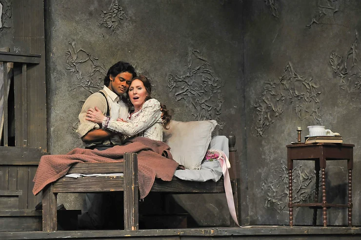 Mary Dunleavy (Mimí) and Sean Panikkar (Rodolfo) embrace for the last time. Photo by Ellen Appel.