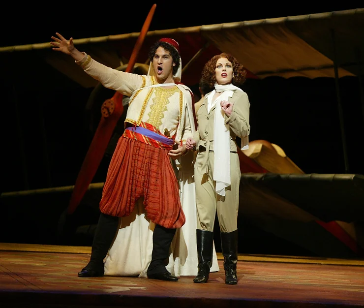 Ali (David Giuliano) and Isabella (Jennifer Dudley) meet on the beach at the scene of a plane wreck; photo by Ellen Appel.