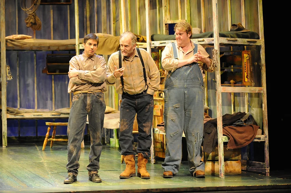 Phillip Addis as George, Stephen West as Candy, and Anthony Dean Griffey as Lennie. Photo by Ellen Appel.