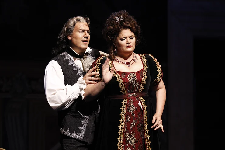 Michael Chioldi (Baron Scarpia) and Carter Scott (Floria Tosca) in Fort Worth Opera's 'Tosca'; photo by Ron Ennis.