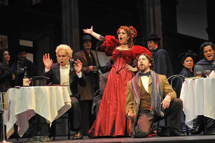 Musetta (Rosa Betancourt) making a scene at Café Momus with Wes Mason (Marcello) and Aaron Sorenson (Alcindoro); photo by Ellen Appel.