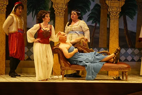 Mustafá (Rod Nelman) sits in his palace as his wife, Elvira (Angela Turner Wilson), laments their marriage. Catering to Mustafá is Ali (David Giuliano) and Zulma (Cindy Sadler); photo by Ellen Appel.
