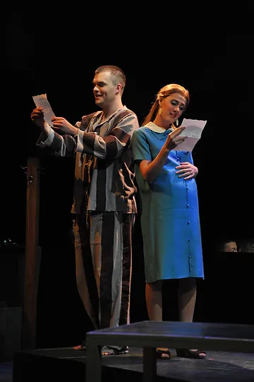 Young Thompson (David Blalock) and Young Alyce (Sydney Mancasola) reading a letter; photo by Ellen Appel.